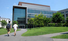 two students walking on quad